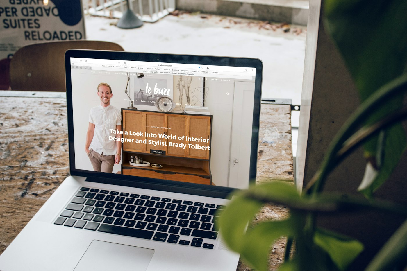 Website open on a laptop on a wooden table